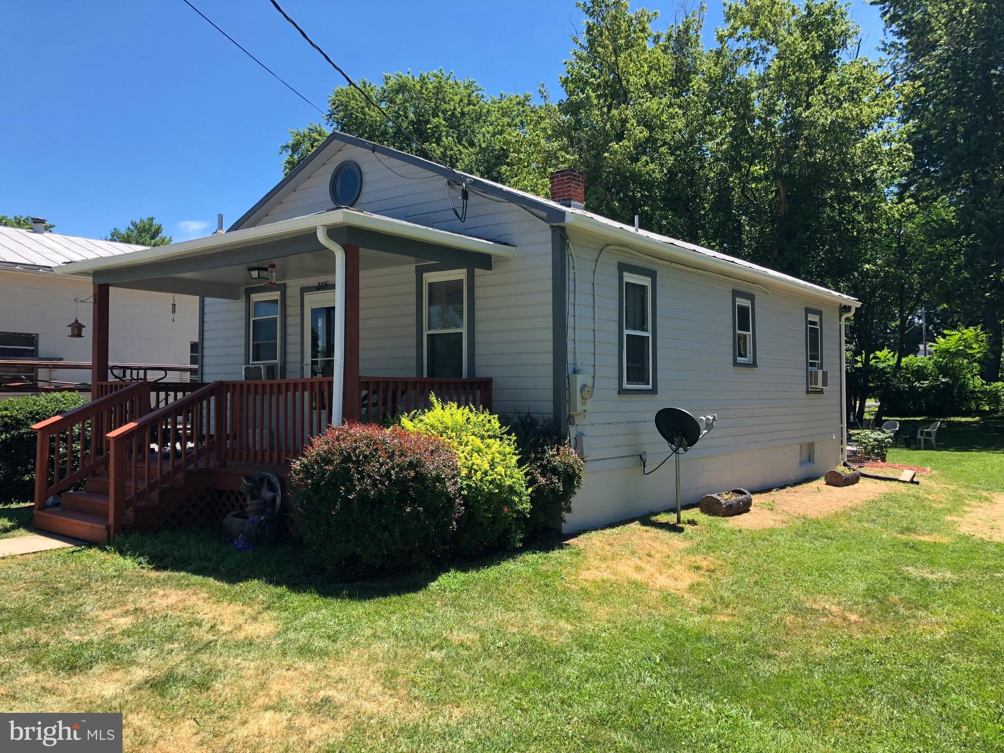 205 East 7th Avenue Ranson, WV 25438 - Photo 3 of 29 a front view of house with yard and trees in the background