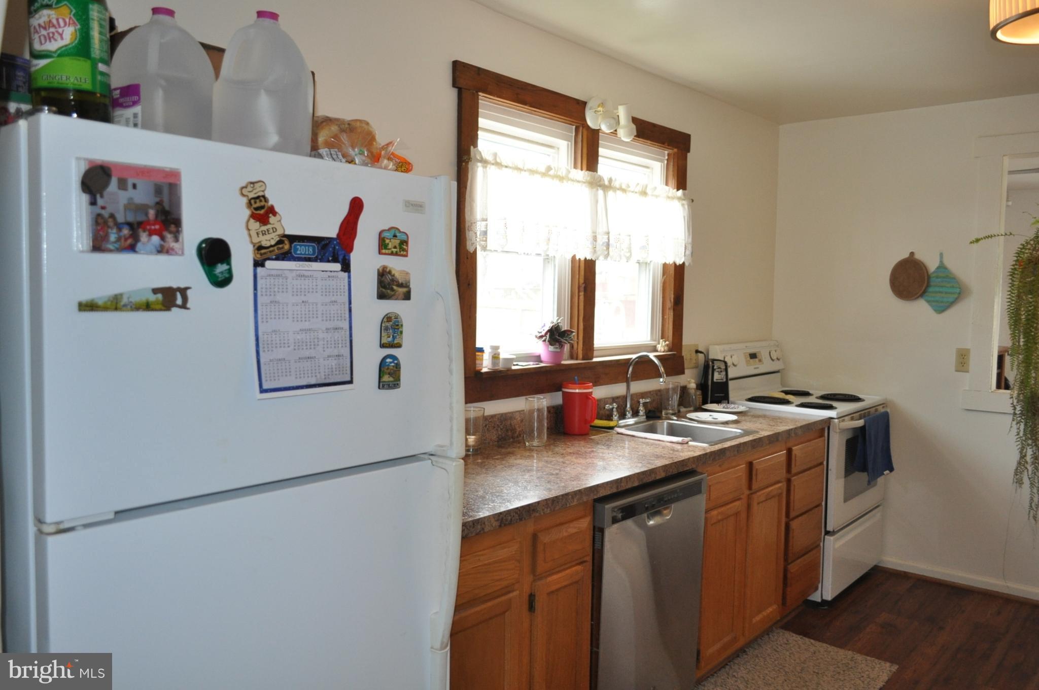 205 East 7th Avenue Ranson, WV 25438 - Photo 21 of 29 a kitchen with a refrigerator and a sink