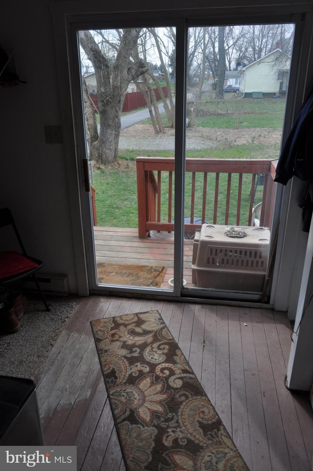 205 East 7th Avenue Ranson, WV 25438 - Photo 24 of 29 a view of a porch with wooden floor and a yard