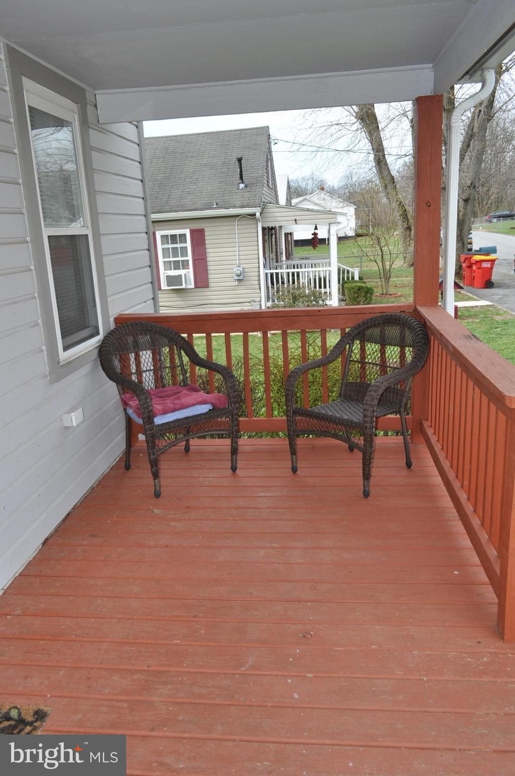 205 East 7th Avenue Ranson, WV 25438 - Photo 5 of 29 a view of a bench in balcony with wooden floor