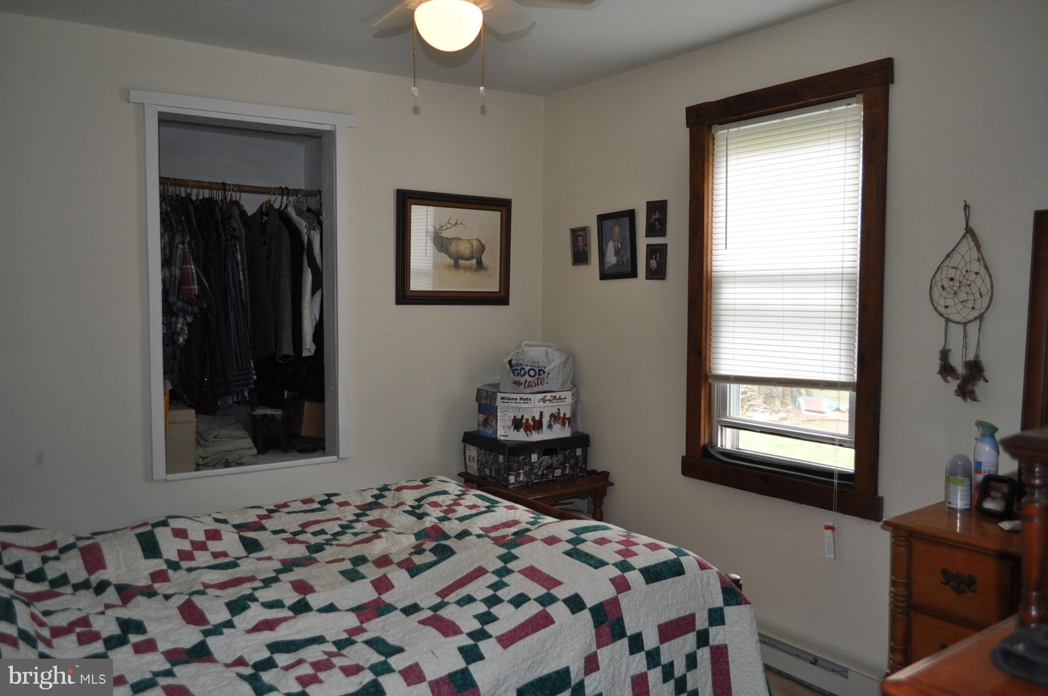 205 East 7th Avenue Ranson, WV 25438 - Photo 7 of 29 a bedroom with a bed and a window