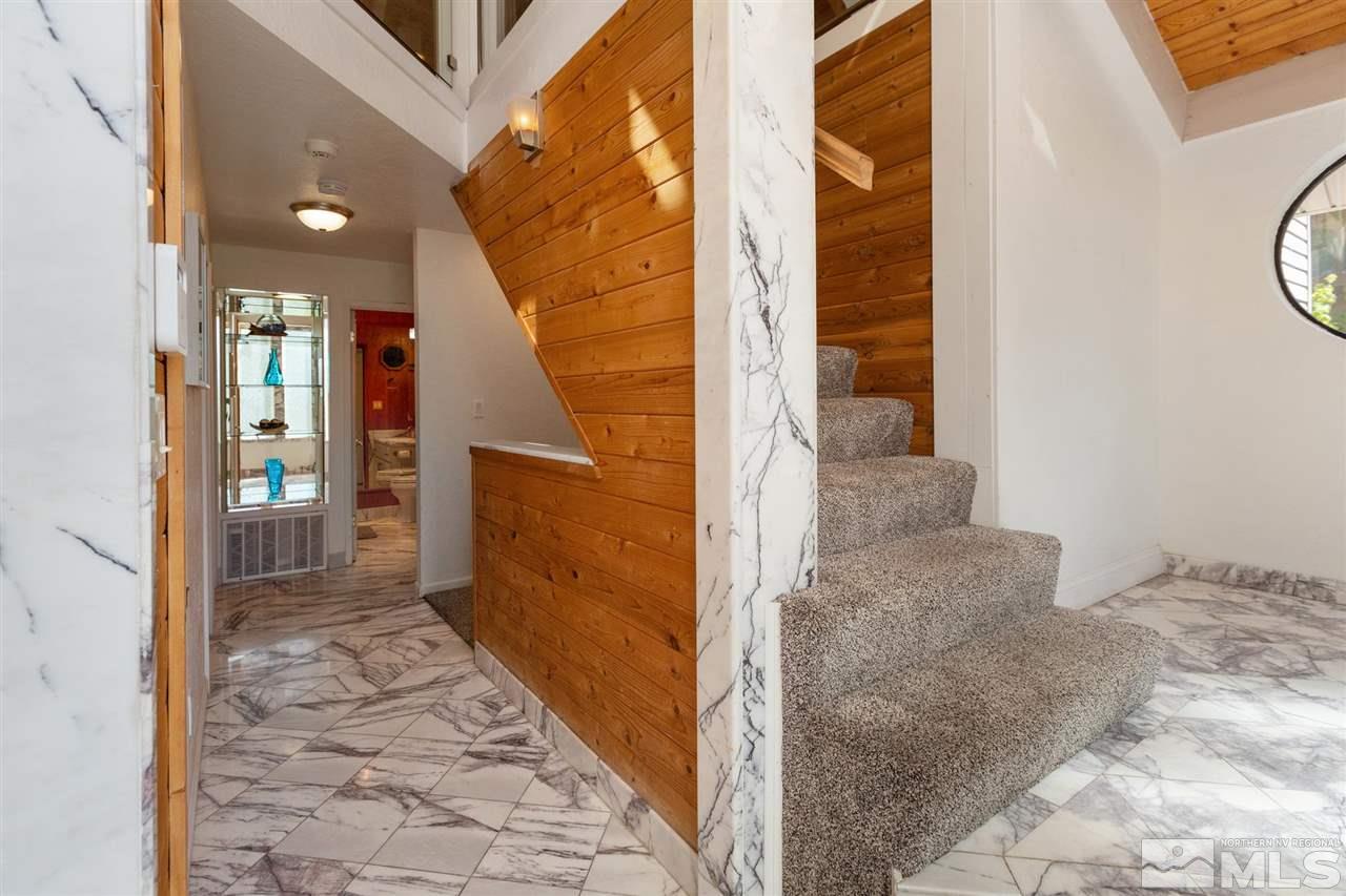 116 B Snowbird Court, Unit B Stateline, NV 89449 - Photo 22 of 40 a view of a hallway with wooden floor and a living room