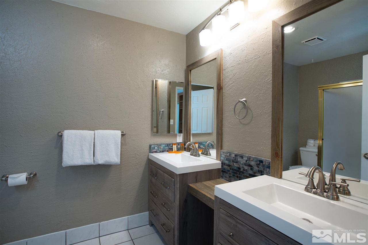 116 B Snowbird Court, Unit B Stateline, NV 89449 - Photo 25 of 40 a bathroom with a sink and a mirror