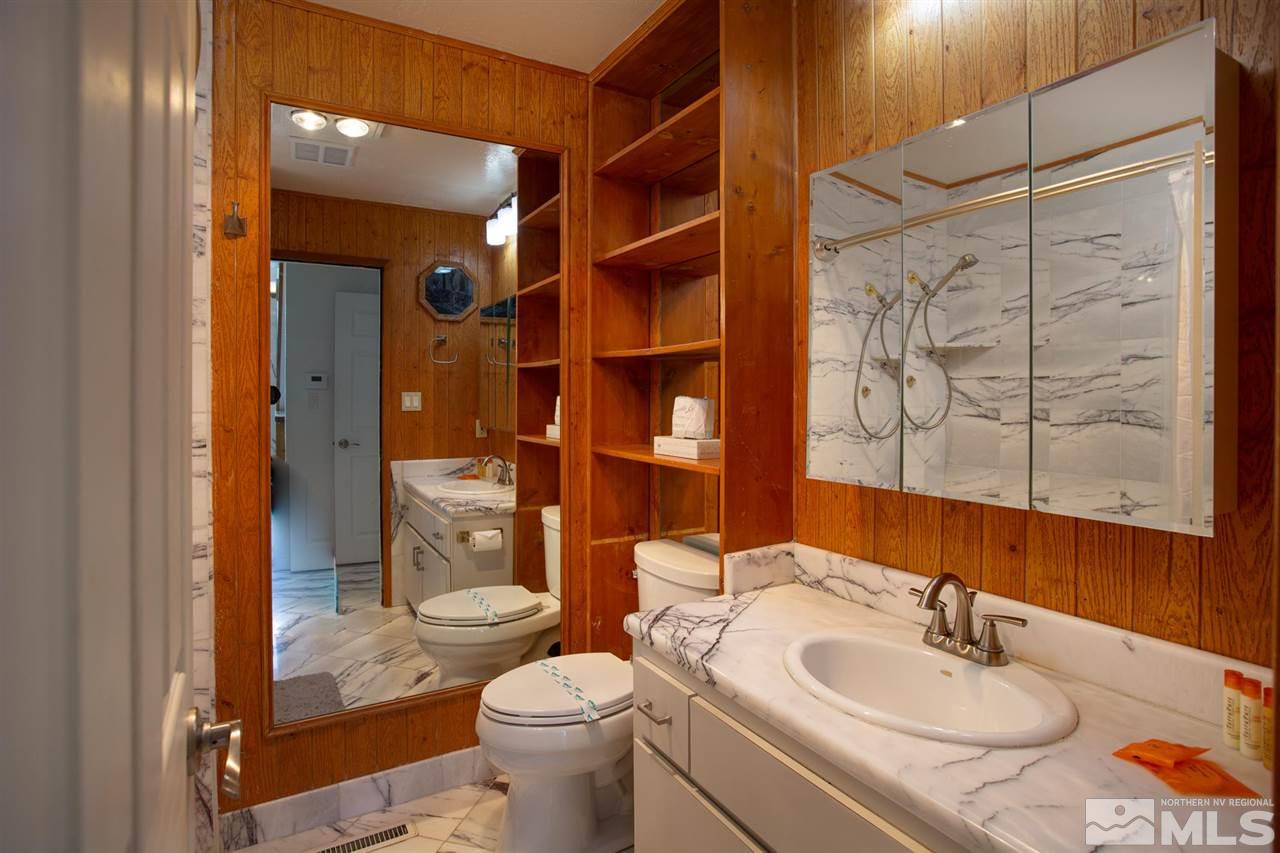 116 B Snowbird Court, Unit B Stateline, NV 89449 - Photo 26 of 40 a bathroom with a sink toilet and shower