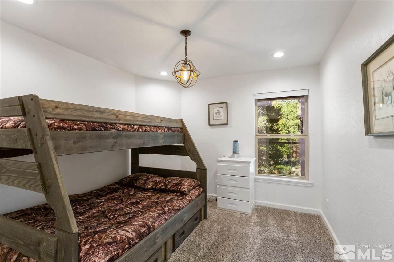 116 B Snowbird Court, Unit B Stateline, NV 89449 - Photo 28 of 40 a bedroom with a bed and a window