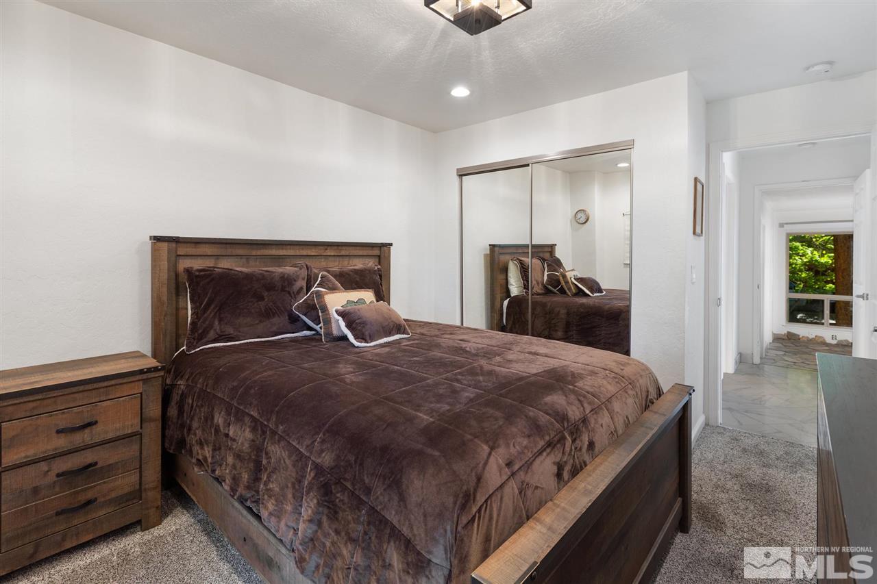 116 B Snowbird Court, Unit B Stateline, NV 89449 - Photo 29 of 40 a bedroom with a bed and a walk in closet