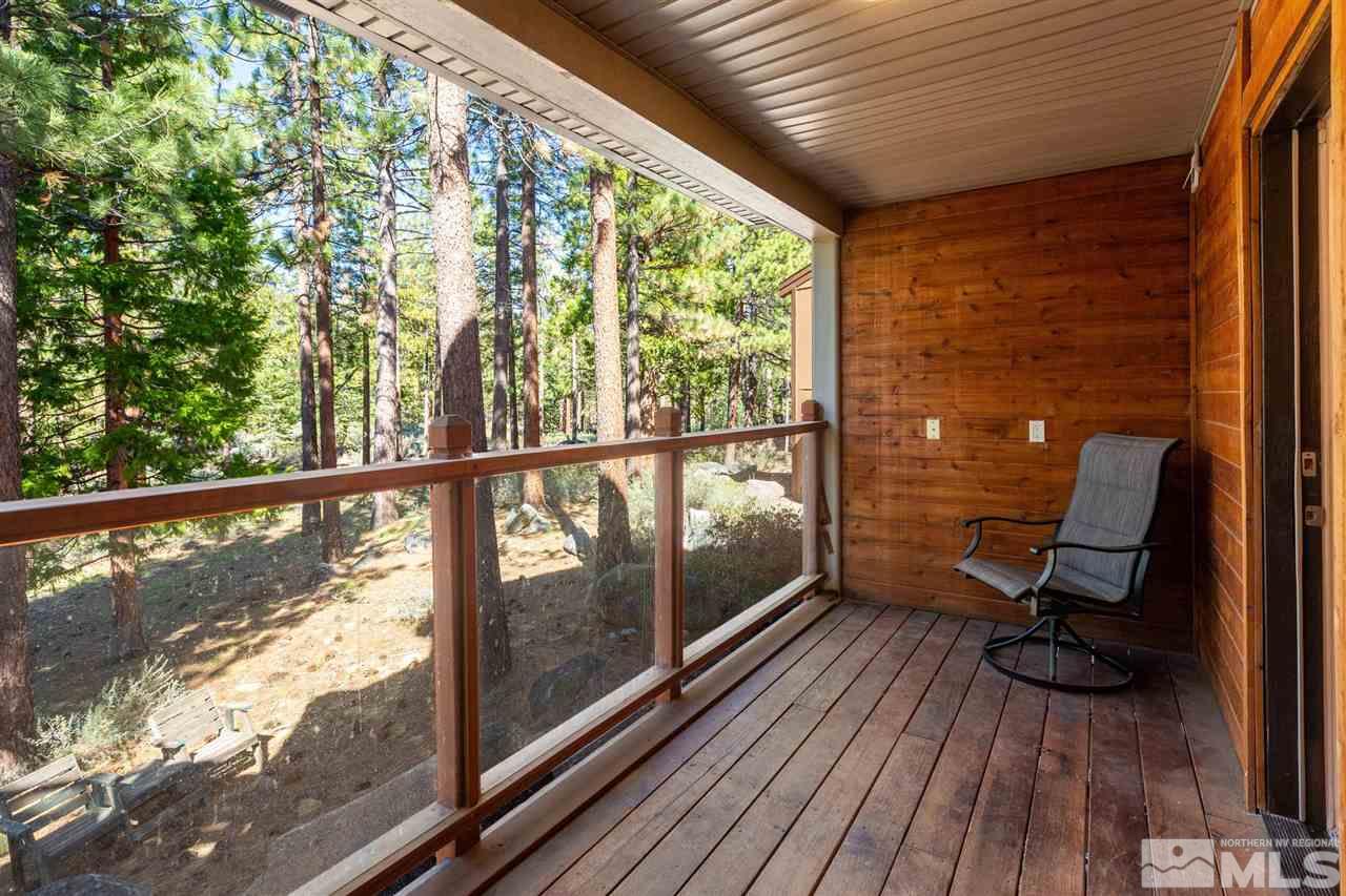 116 B Snowbird Court, Unit B Stateline, NV 89449 - Photo 31 of 40 a view of a balcony with chair and wooden floor