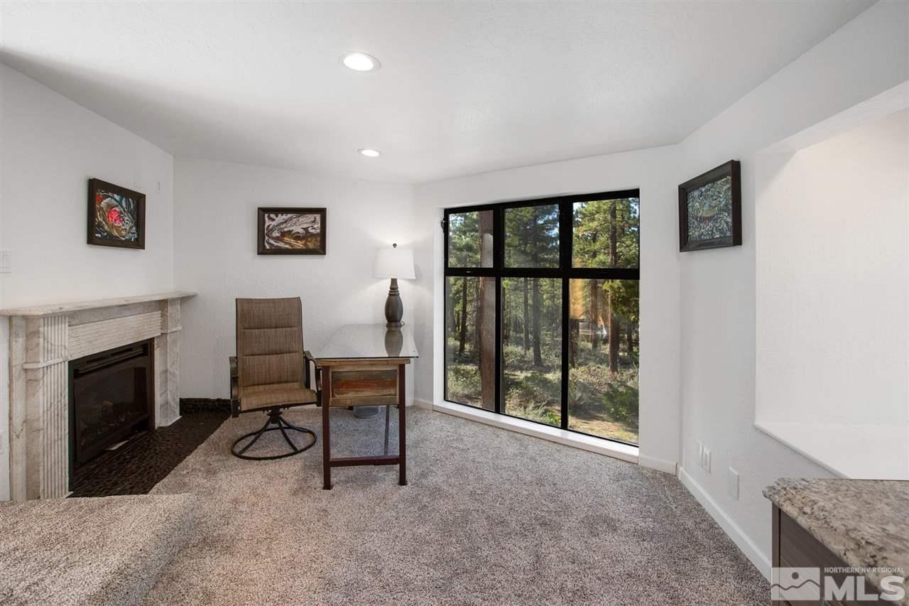 116 B Snowbird Court, Unit B Stateline, NV 89449 - Photo 33 of 40 a view of a livingroom with furniture and a fireplace