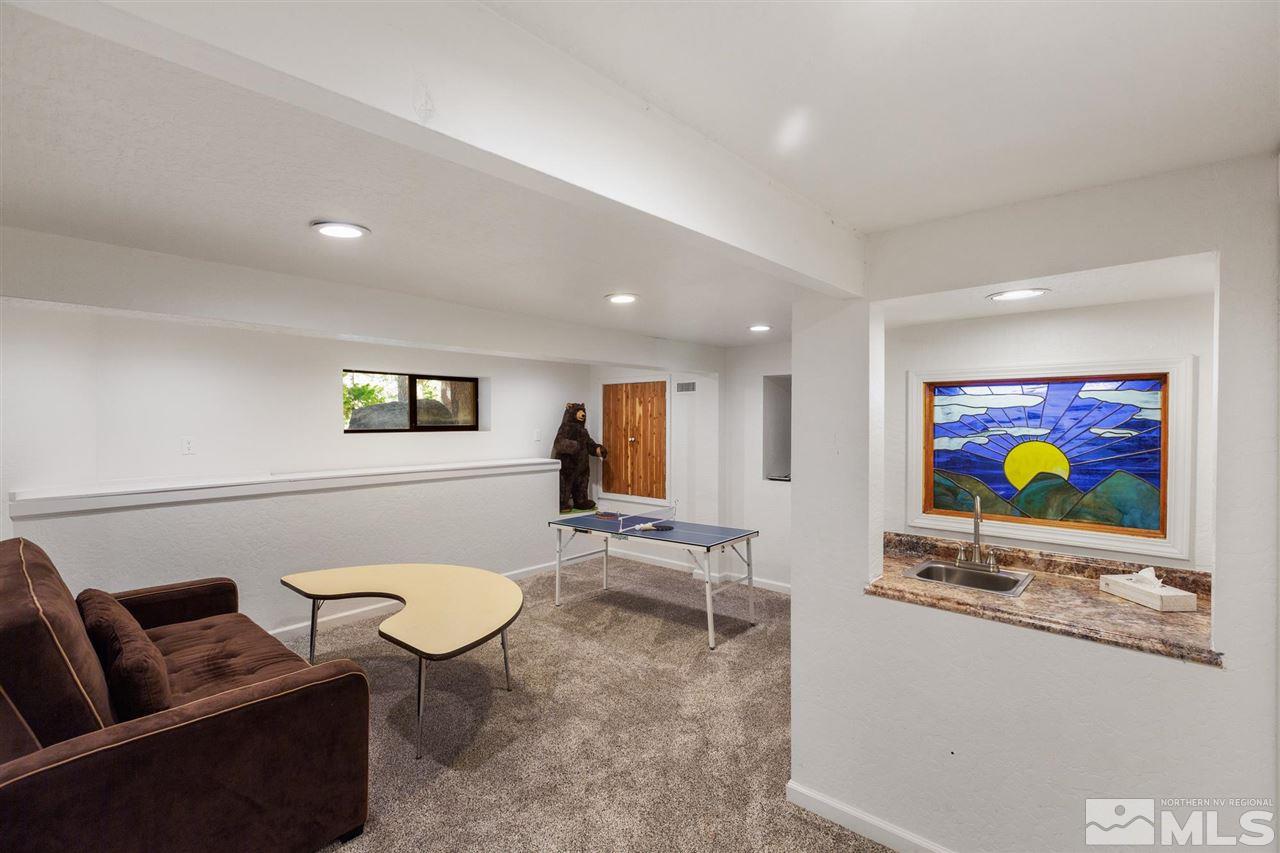 116 B Snowbird Court, Unit B Stateline, NV 89449 - Photo 36 of 40 a living room with furniture and a flat screen tv