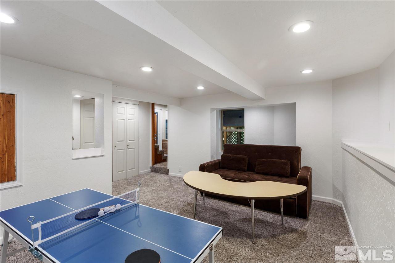 116 B Snowbird Court, Unit B Stateline, NV 89449 - Photo 37 of 40 a living room with furniture and a table