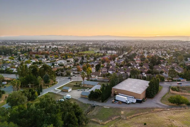 an aerial view of a house with a garden