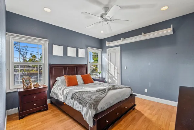 a dining hall with stainless steel appliances granite countertop a stove a sink a dining table and chairs