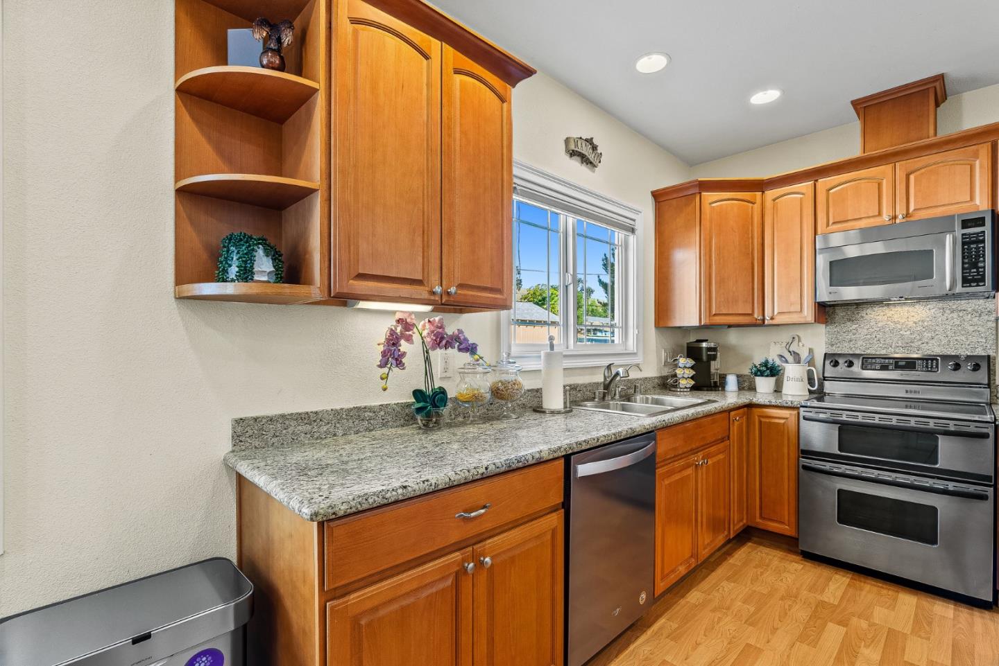 1995 Old Calaveras Road Milpitas, CA 95035 - Photo 42 of 53 a kitchen with stainless steel appliances granite countertop a stove a sink and a microwave