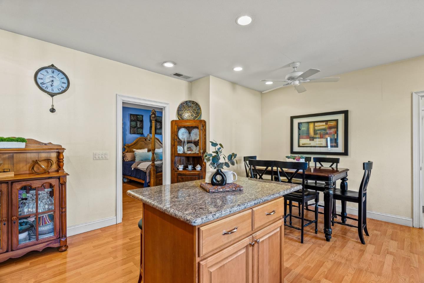 1995 Old Calaveras Road Milpitas, CA 95035 - Photo 43 of 53 a kitchen with stainless steel appliances granite countertop a dining table chairs and wooden floor