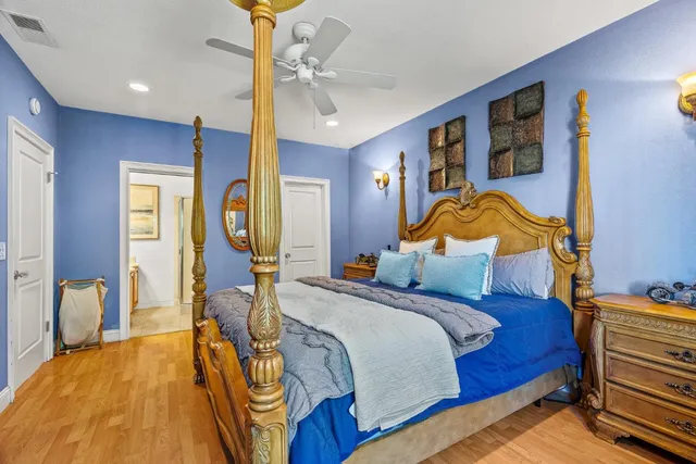 a bathroom with a granite countertop sink a mirror and a shower