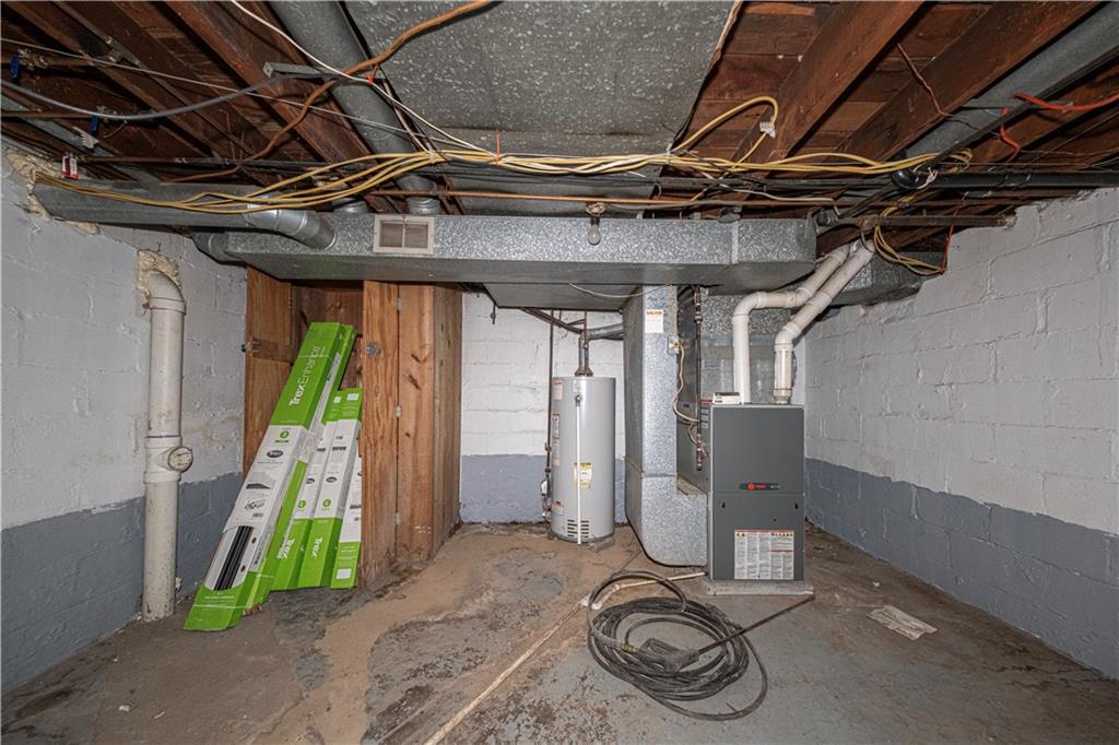 7300 Hutchinson Road Elizabeth, PA 15037 - Photo 34 of 42 Furnace room. Both furnace & water tank were installed in 2014, according to the stickers on the appliances. There's plenty of room in here for storage.