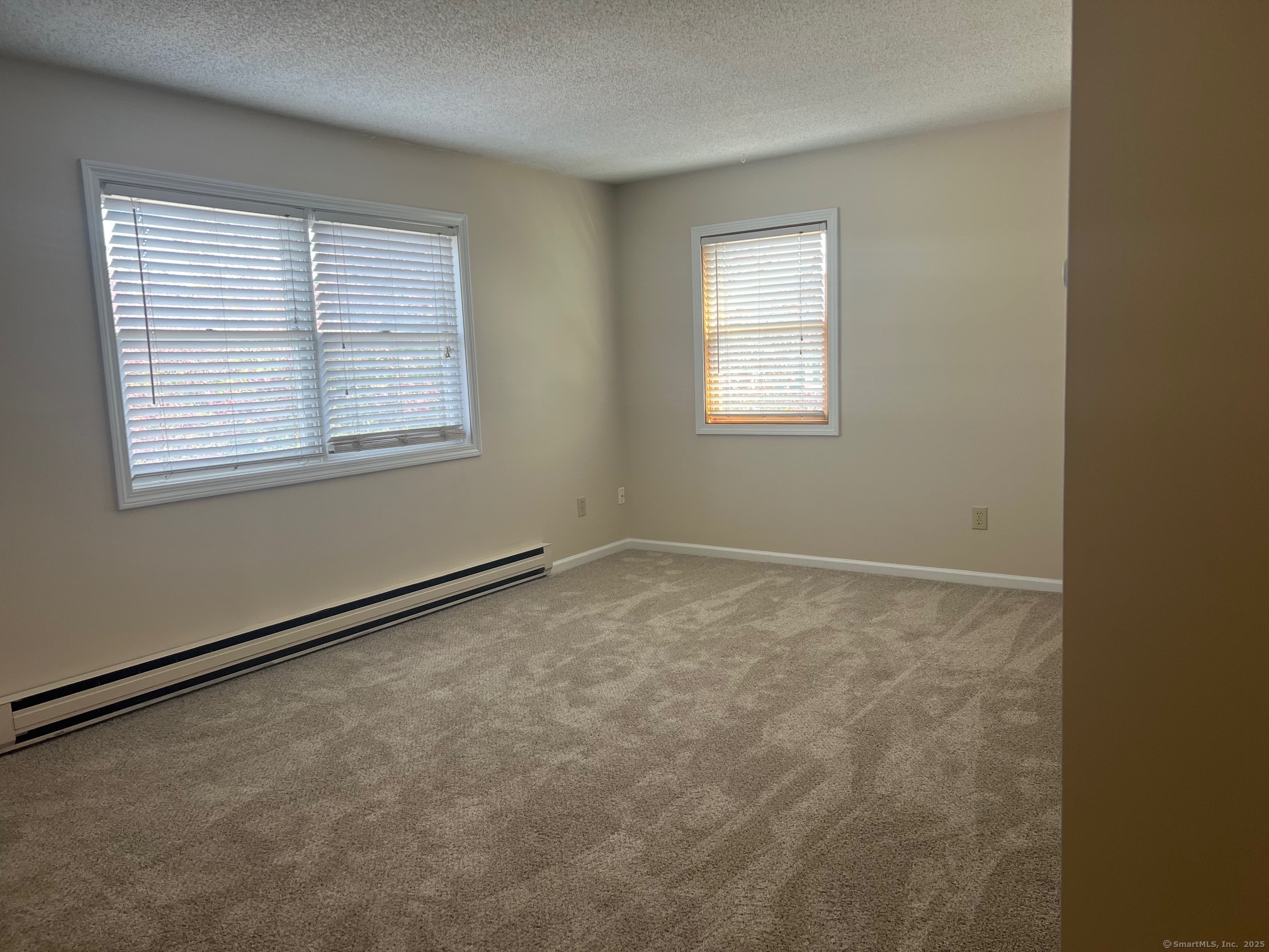21 Prospect Street, Unit 1 Torrington, CT 06790 - Photo 4 of 13 an empty room with a window