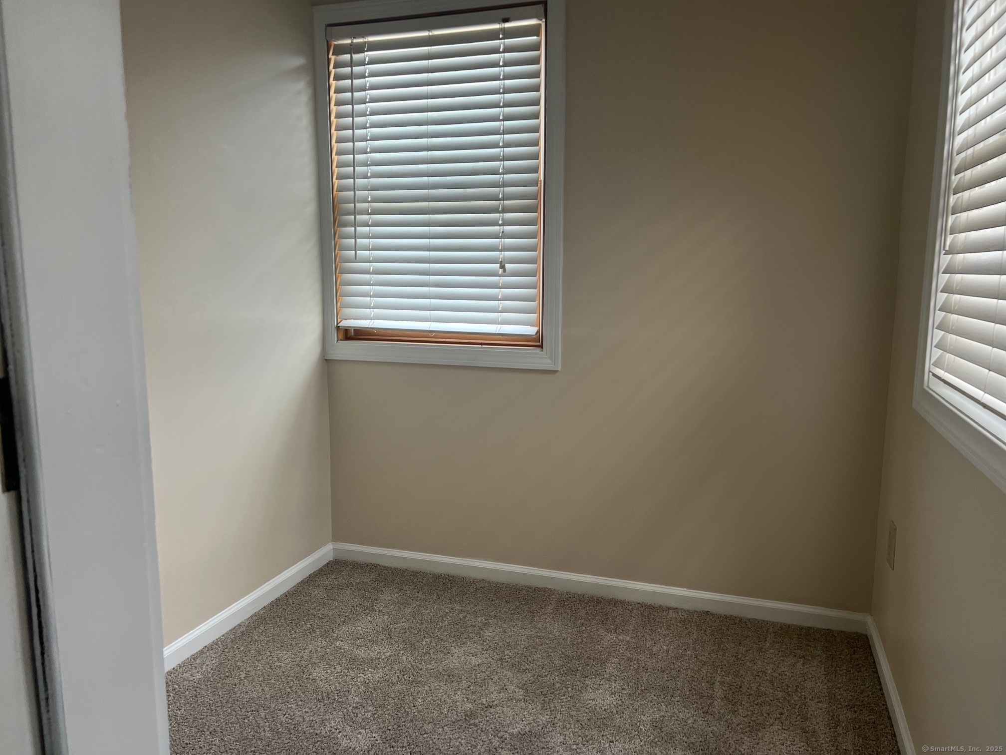 21 Prospect Street, Unit 1 Torrington, CT 06790 - Photo 7 of 13 an empty room with a window