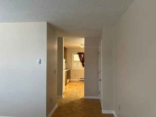 a view of a bathroom from a hallway