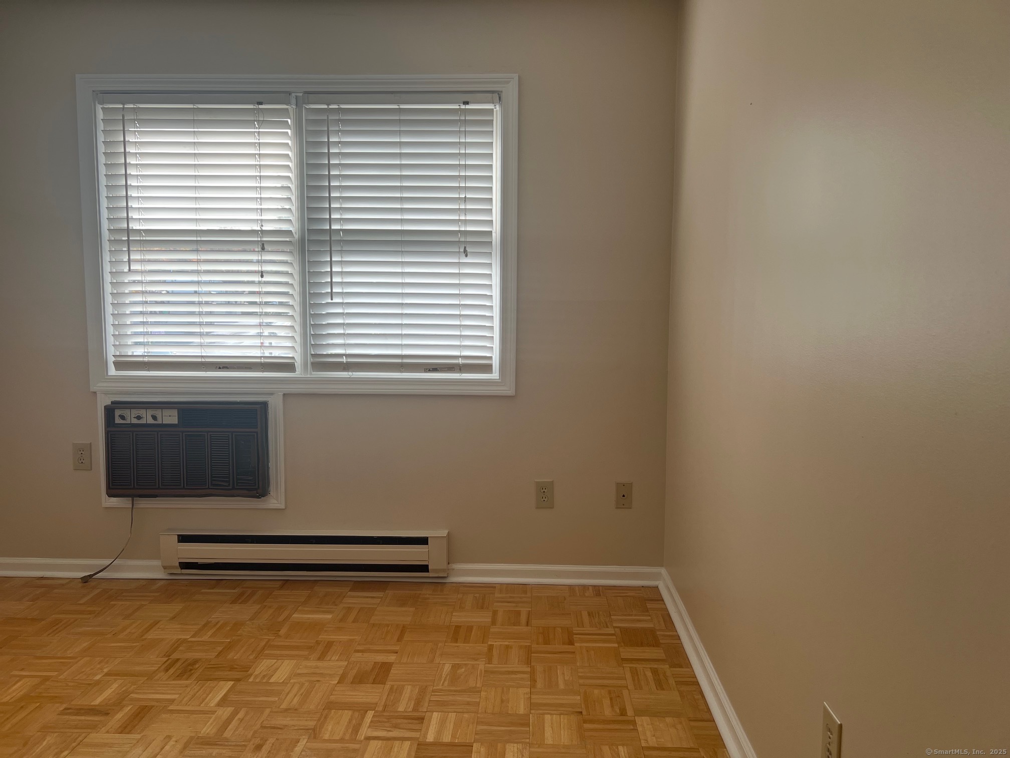 21 Prospect Street, Unit 1 Torrington, CT 06790 - Photo 9 of 13 a view of a livingroom with an empty space and a window