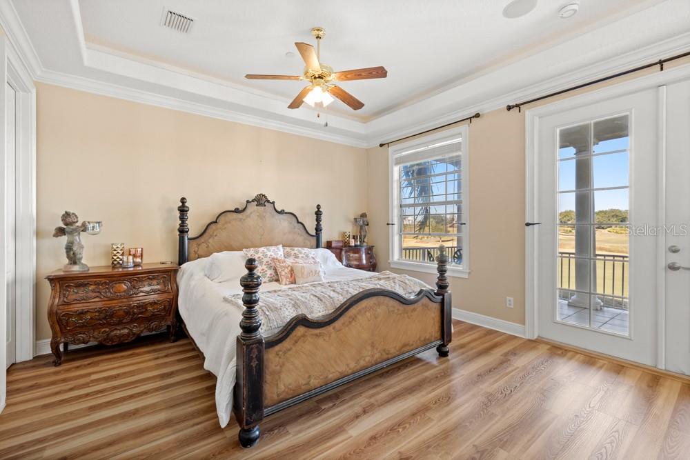7423 Excitement Drive Reunion, FL 34747 - Photo 25 of 99 a bedroom with a bed and wooden floor