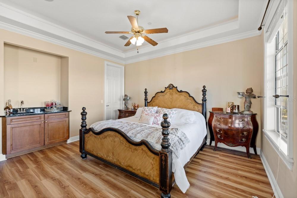 7423 Excitement Drive Reunion, FL 34747 - Photo 26 of 99 a bed room with a bed and a ceiling fan