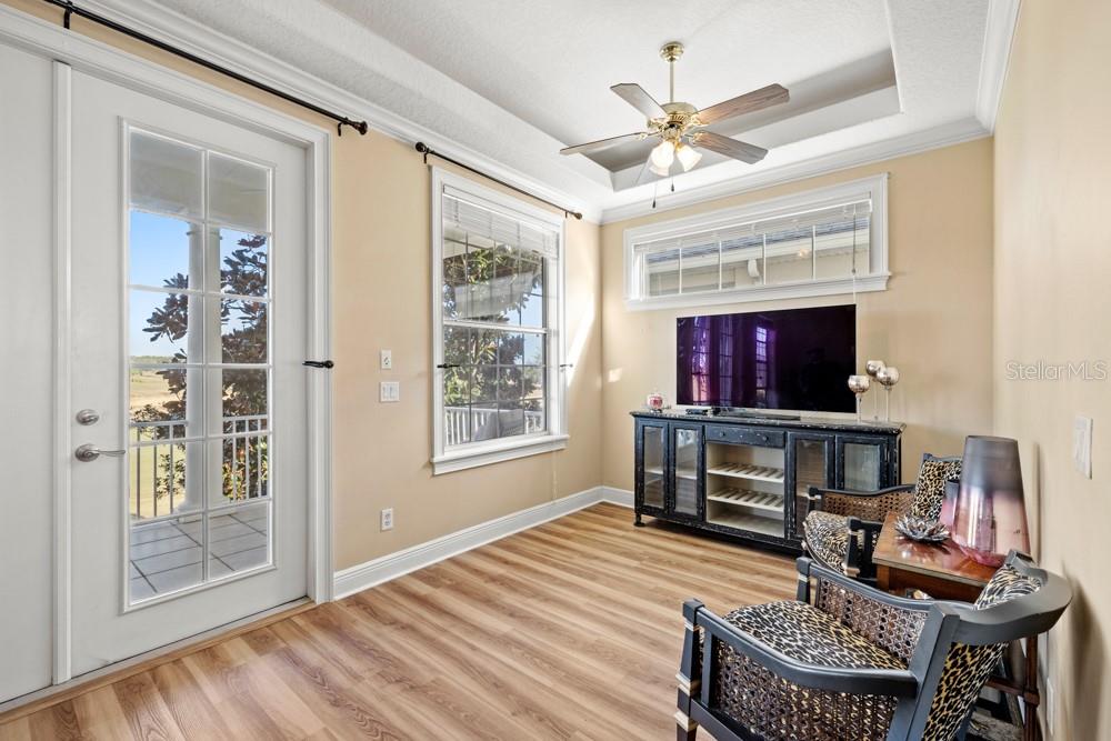7423 Excitement Drive Reunion, FL 34747 - Photo 29 of 99 a living room with furniture a flat screen tv and a fireplace