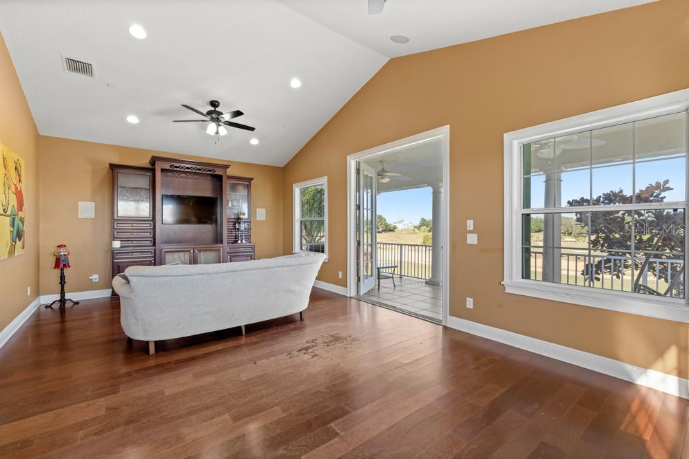 7423 Excitement Drive Reunion, FL 34747 - Photo 36 of 99 a living room with furniture and a wooden floor
