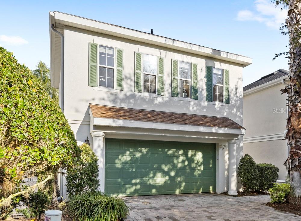 7423 Excitement Drive Reunion, FL 34747 - Photo 5 of 99 a front view of a house with garden