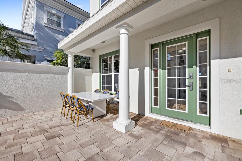 7423 Excitement Drive Reunion, FL 34747 - Photo 53 of 99 a view of a patio with table and chairs and wooden fence