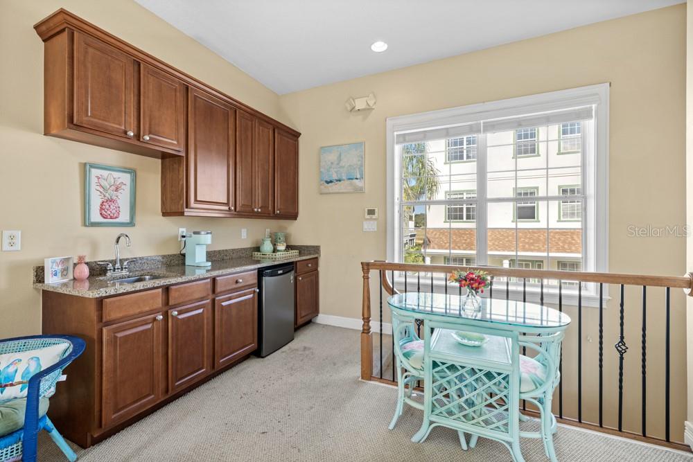 7423 Excitement Drive Reunion, FL 34747 - Photo 57 of 99 a kitchen with stainless steel appliances granite countertop a stove a sink and a refrigerator