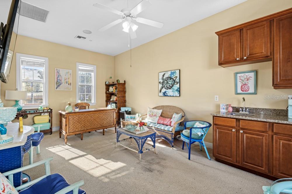 7423 Excitement Drive Reunion, FL 34747 - Photo 59 of 99 a living room with furniture cabinets and window