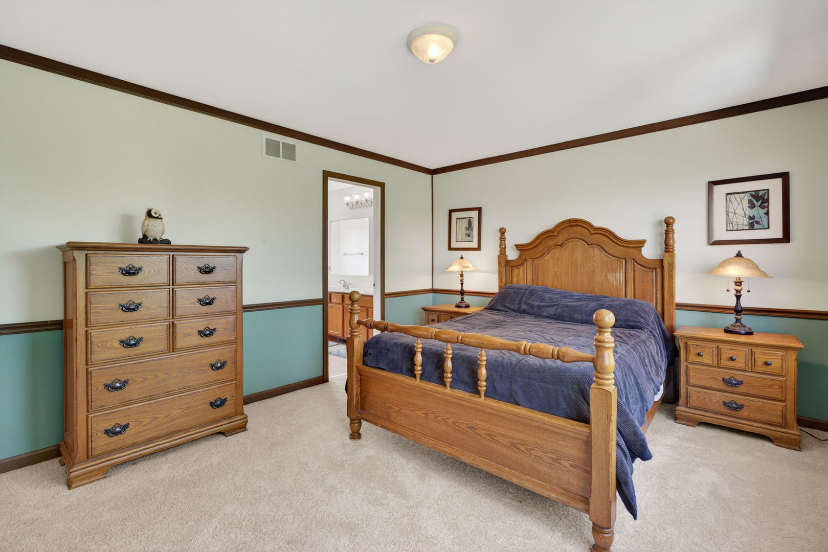 25204 Spring Street Manhattan, IL 60442 - Photo 16 of 34 a bed room with a bed and a dresser