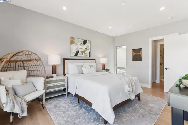 a bedroom with a bed and a couch