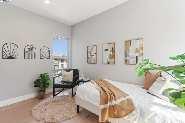 a bedroom with bed and a couch