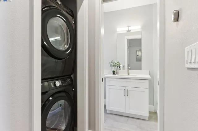 a view of a hallway with washer and dryer