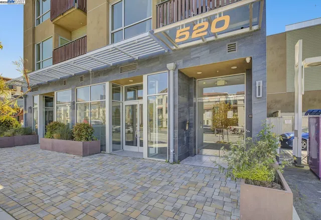 a couple of cars parked in front of a house