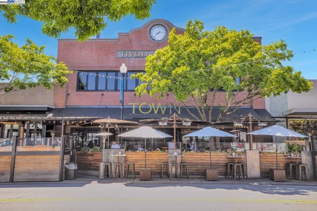 a view of a building with sitting area