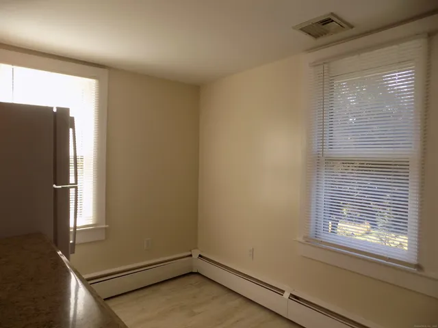 a view of a room that has a window in it