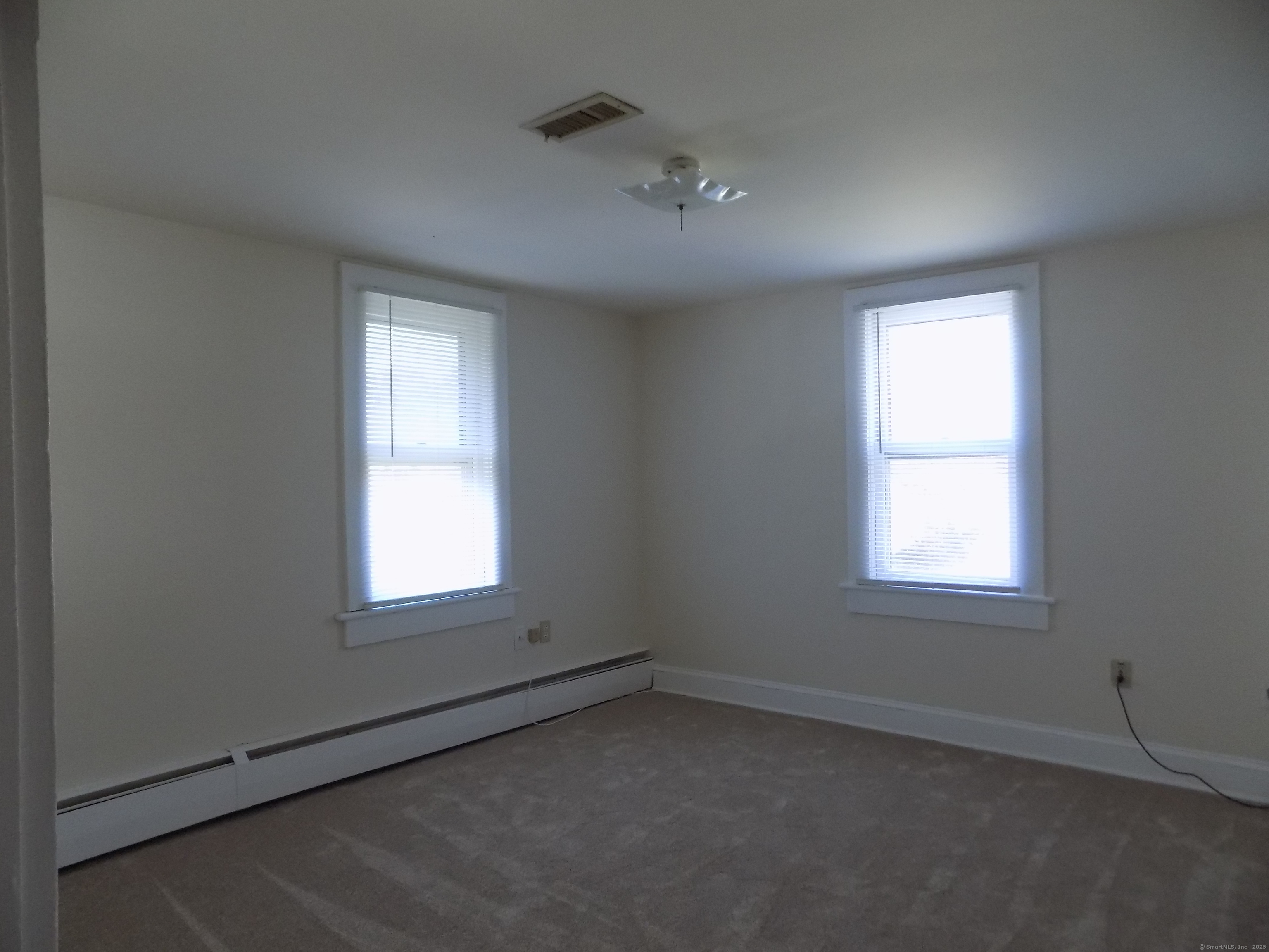 6 Hillside Avenue, Unit B New Milford, CT 06776 - Photo 5 of 12 an empty room with a window