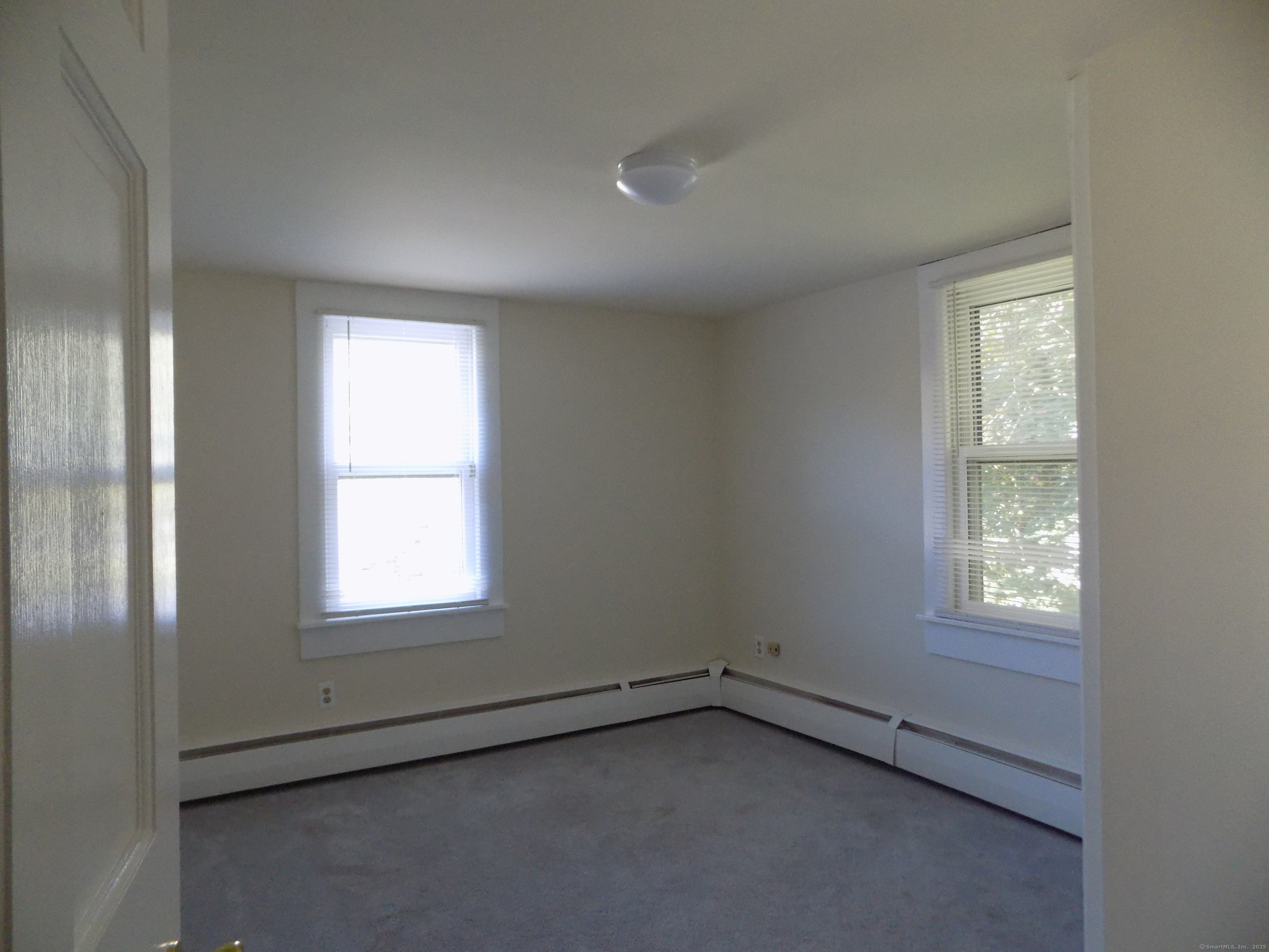 6 Hillside Avenue, Unit B New Milford, CT 06776 - Photo 7 of 12 an empty room with a window