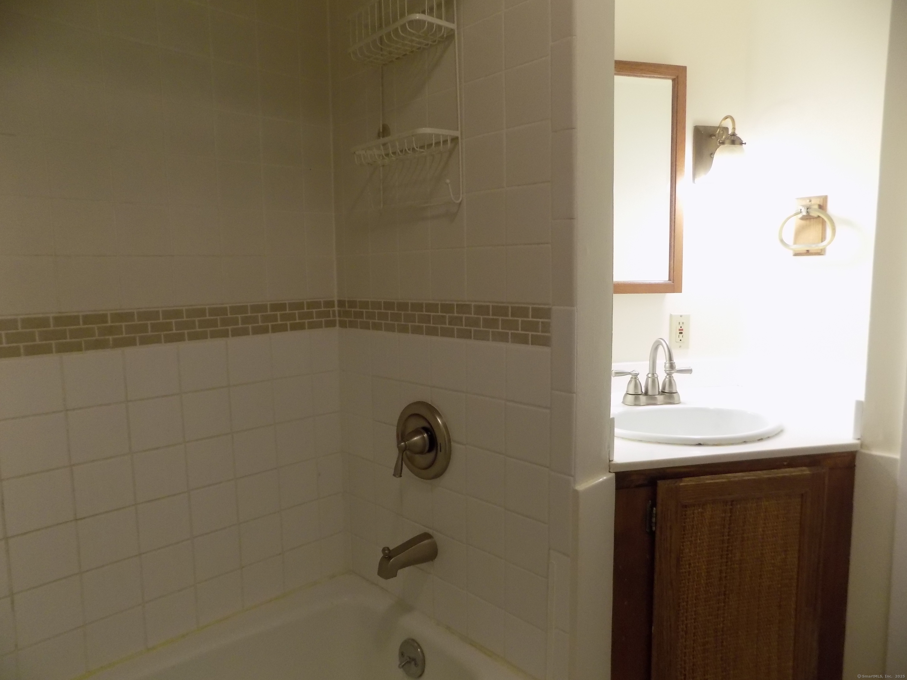 6 Hillside Avenue, Unit B New Milford, CT 06776 - Photo 9 of 12 a bathroom with a sink a toilet and shower