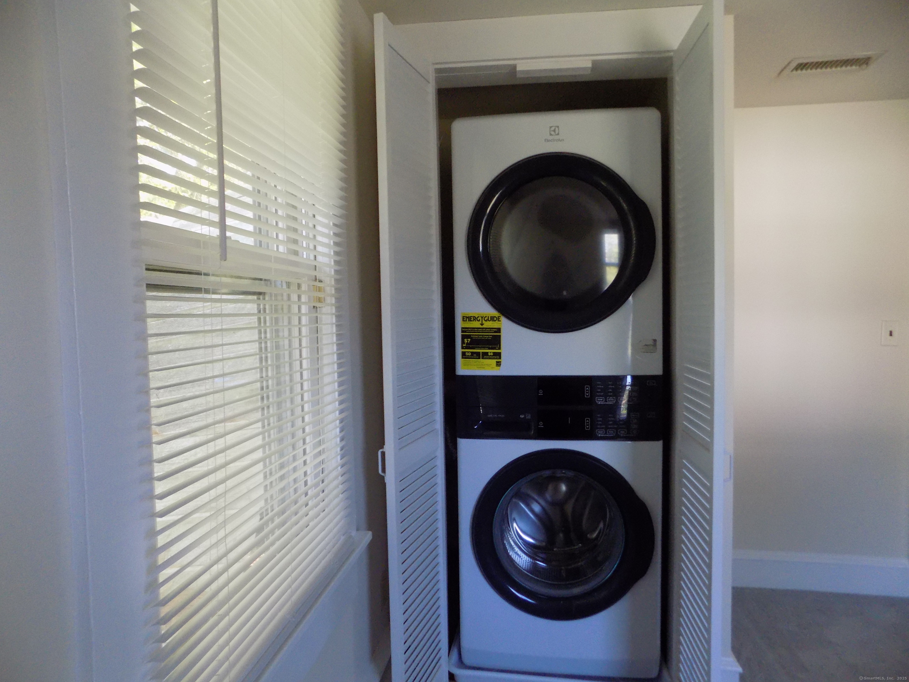 6 Hillside Avenue, Unit B New Milford, CT 06776 - Photo 10 of 12 a view of a bedroom with a washer and dryer