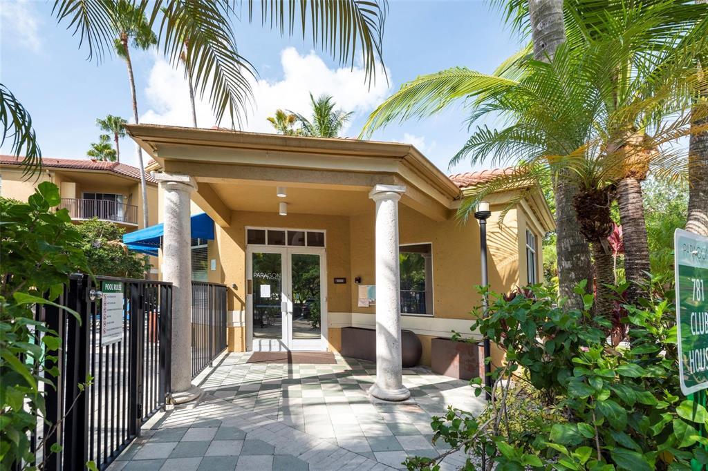 741 North Pine Island Road, Unit 303 Plantation, FL 33324 - Photo 23 of 32 a front view of a house with a garden