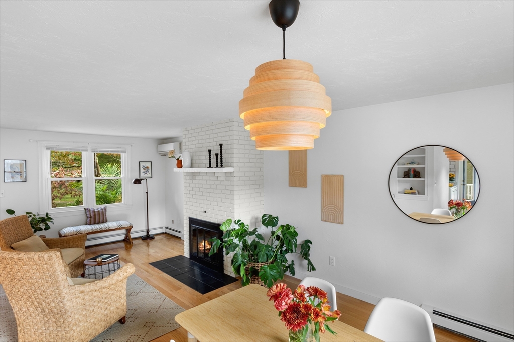 12 State Road, Unit 3D Plymouth, MA 02360 - Photo 12 of 30 a living room with furniture chandelier and a large window