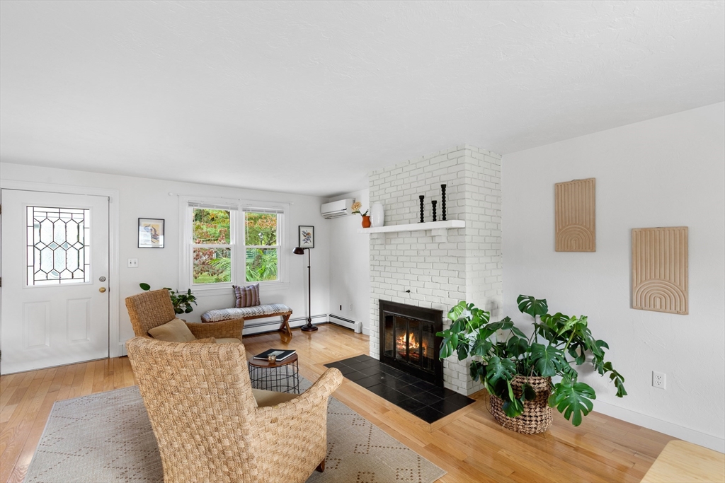 12 State Road, Unit 3D Plymouth, MA 02360 - Photo 13 of 30 a living room with furniture and a fireplace