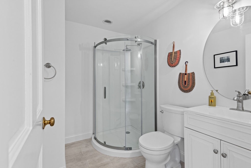 12 State Road, Unit 3D Plymouth, MA 02360 - Photo 22 of 30 a bathroom with a granite countertop toilet sink and shower