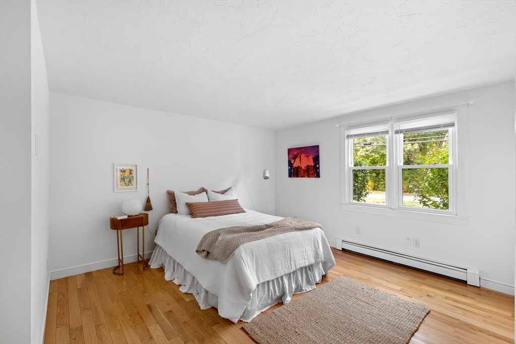 12 State Road, Unit 3D Plymouth, MA 02360 - Photo 23 of 30 a bedroom with a bed and a window
