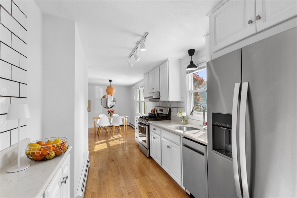 12 State Road, Unit 3D Plymouth, MA 02360 - Photo 3 of 30 a kitchen with stainless steel appliances a refrigerator sink and cabinets