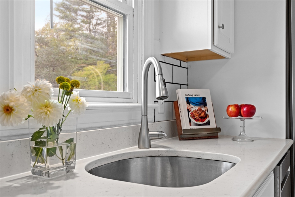 12 State Road, Unit 3D Plymouth, MA 02360 - Photo 7 of 30 a kitchen with a sink a counter and a window